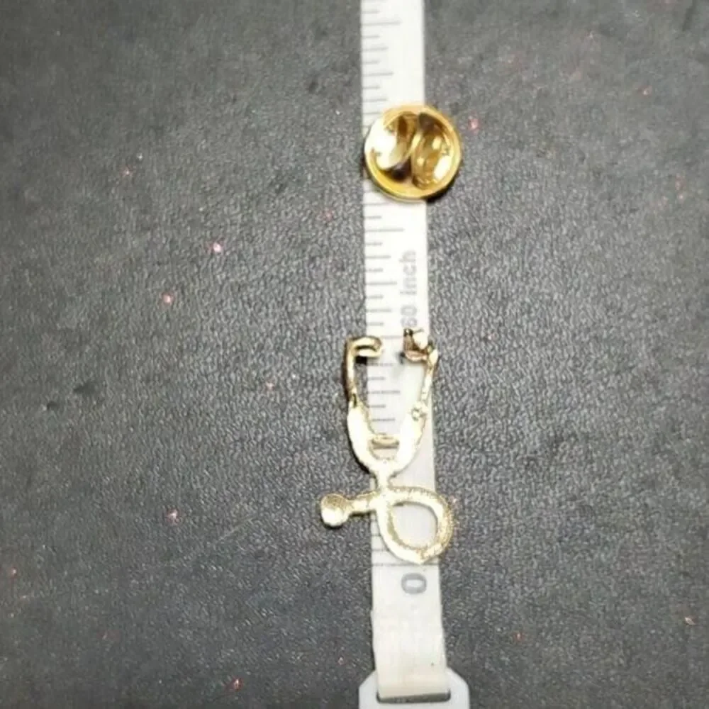 Gold tone stethoscope pin
